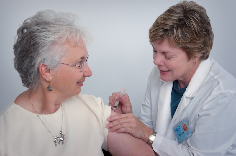 Home health nurse with patient